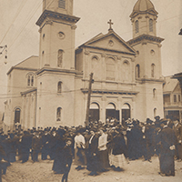 Historical photo of a group outside of a church